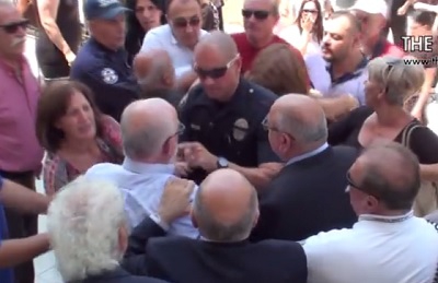 Protesters Physically Attacked by Church Member